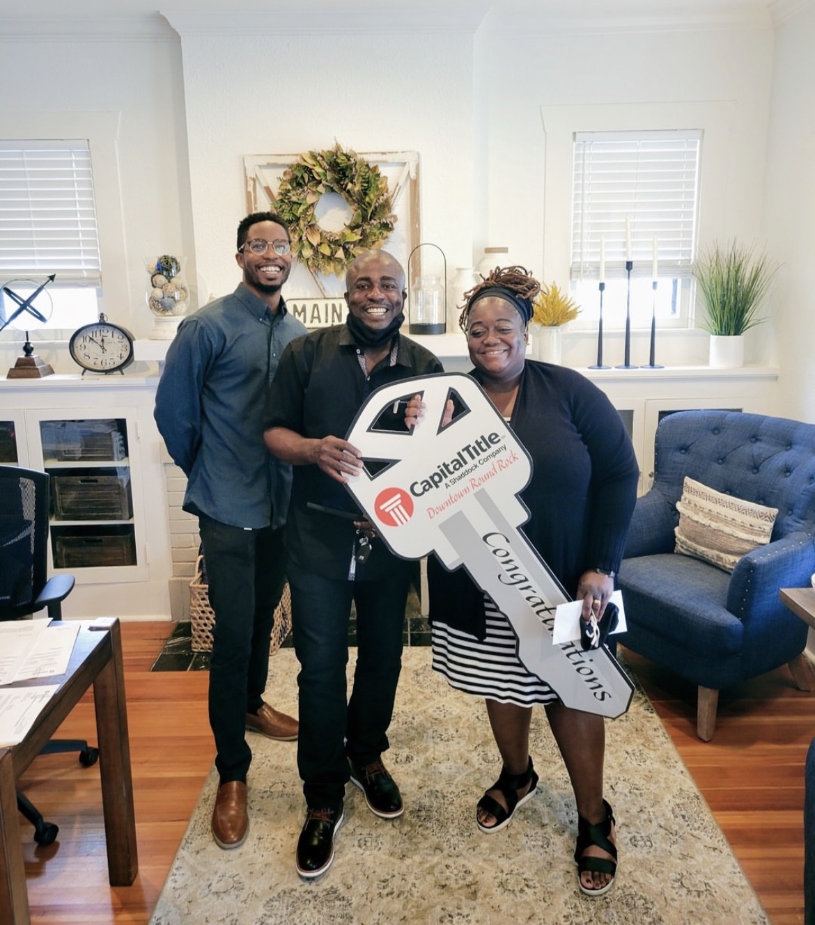 Keys in hand — closing day smiles.