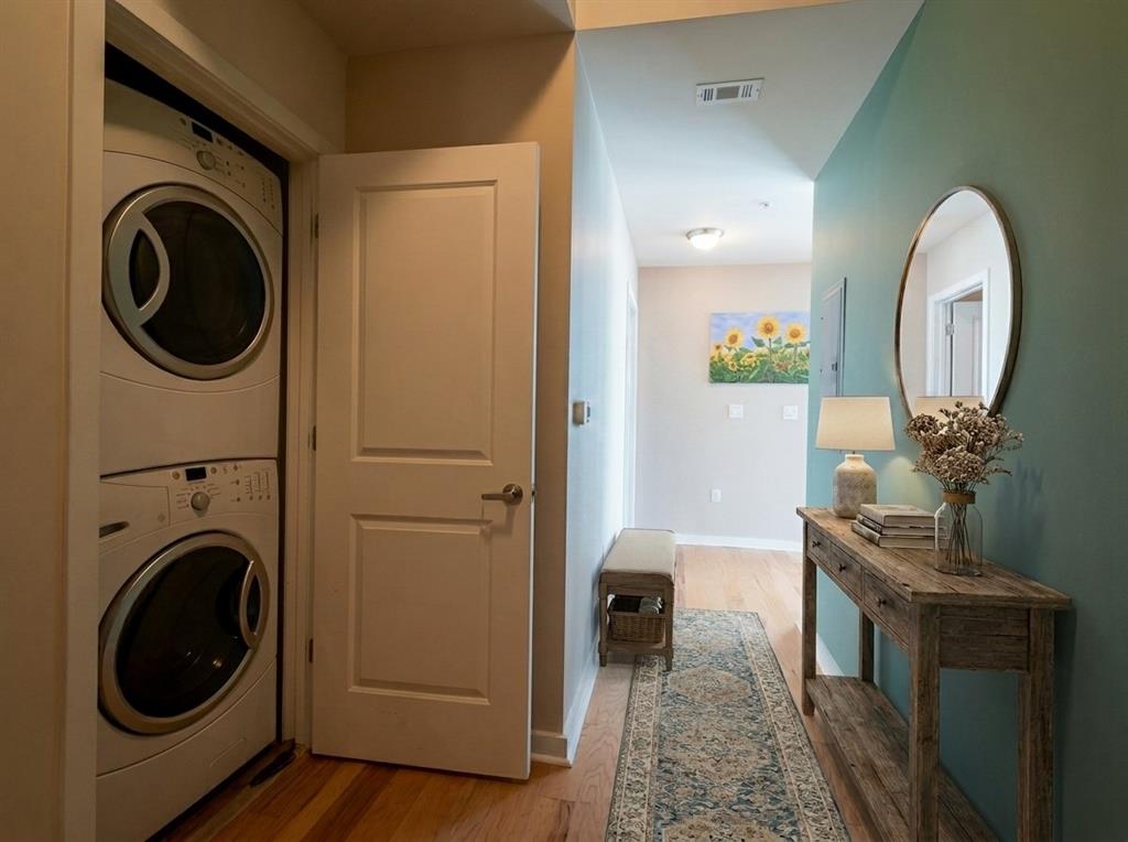Entry hall with in-unit stacked washer and dryer closet
